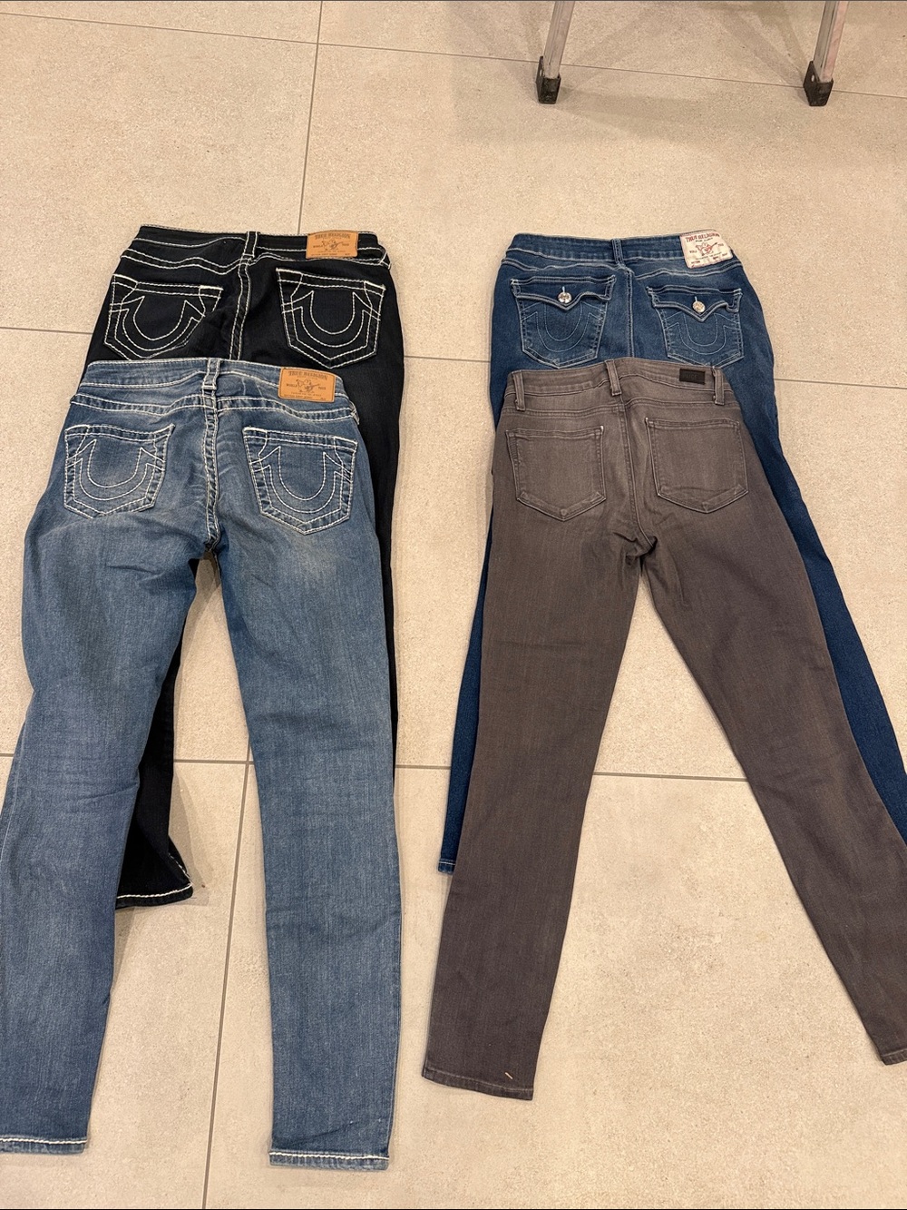 Lot of 4 Skinny jeans.  True Religion & Paige 27” & 28”. Excellent Condition